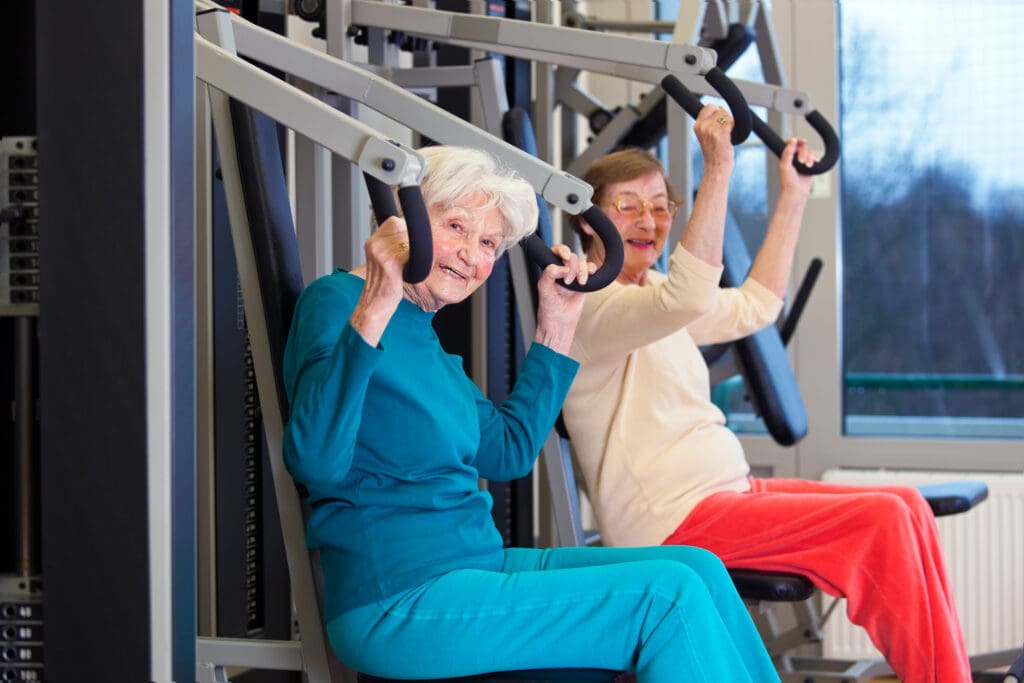 Senior women working out using arm press