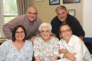 Surrounded by loved ones, resident Evelyn Gentile (center) shares Mother’s Day with her family, including (left to right, back row) Michael White and Robert Gentile and front row (left) Terry White and Wendy Gentile (right).