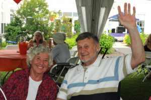 Village at Proprietors Green residents Bob Davis and Joan Coogan wave to the photographer as they take a moment to relax during the annual Family Day at Village at Proprietors Green.