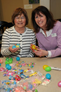 Working alongside Jane Spitz (right), from the community’s Activities Department, Village at Proprietors Green resident Nickie Pelczar wastes no time filling an egg.