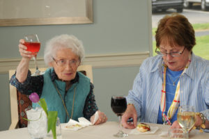 A special occasion such as Mother’s Day wouldn’t be the same without a proper toast. Resident Doris Coghlan raises her glass, seated next to Maureen Canty.