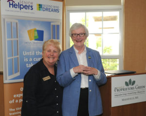 Director of Community Relations for Welch Senior Living Lynda Chuckran takes a moment with Ellen Gillis, outreach coordinator for the Duxbury Senior Center at the Virtual Dementia Tour program held at Village at Proprietors Green.