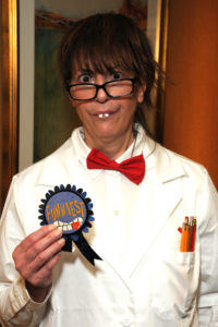 Activity Assistant Jane Spitz received a ribbon for “Funniest” costume, coming to the Village at Proprietors Green party as a very convincing “Nutty Professor,” from the Jerry Lewis movie.
