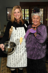 Cooking up a little magic on Halloween at Proprietors Green are left to right, staffers Suzanne Baker and Karen Coakley.