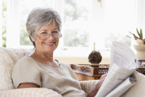 Senior woman reading a newspaper
